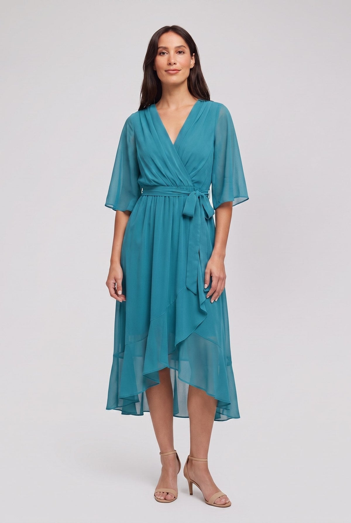 Teal turquoise Gina wrap midi dress with V-neck and flutter sleeves on model