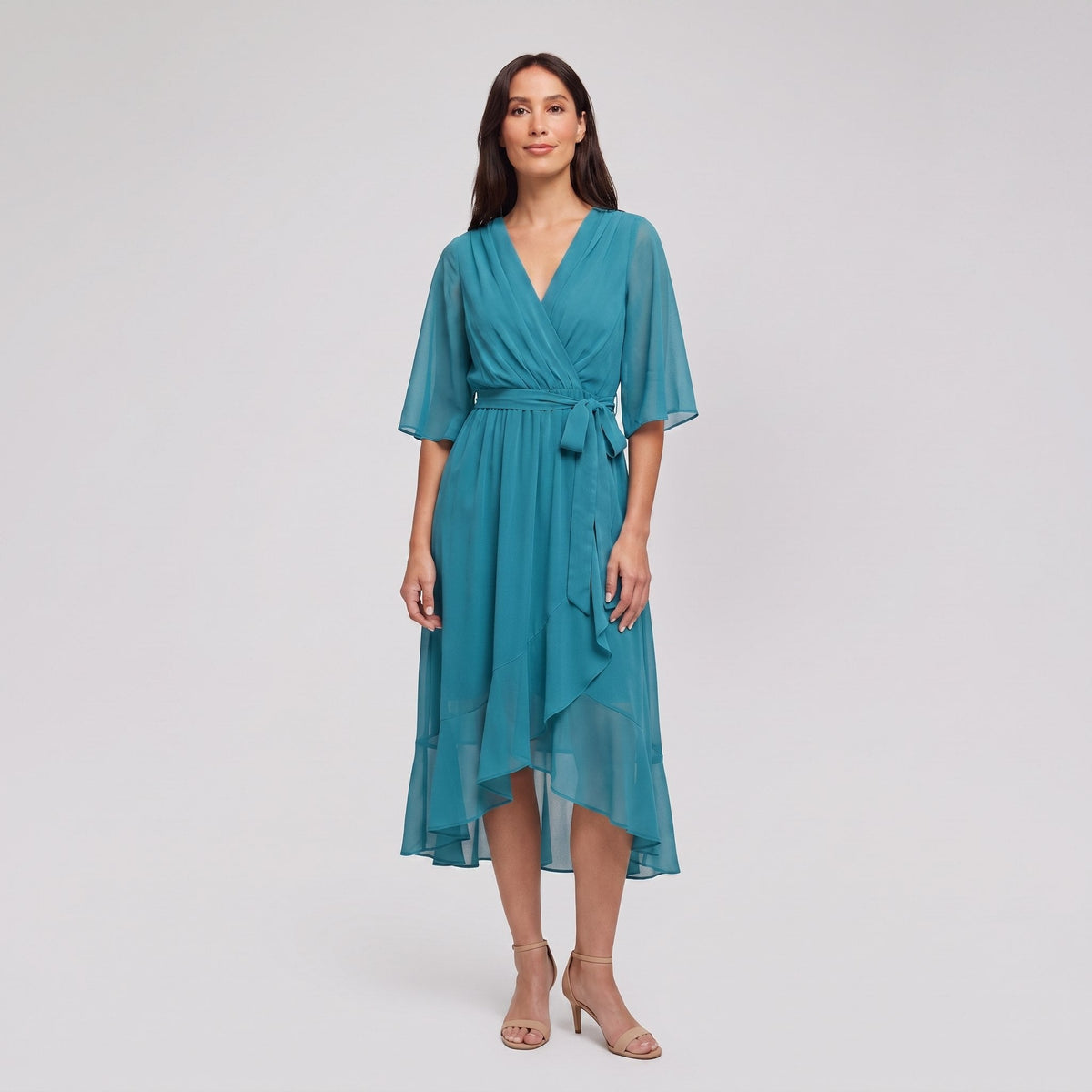 Teal turquoise Gina wrap midi dress with V-neck and flutter sleeves on model