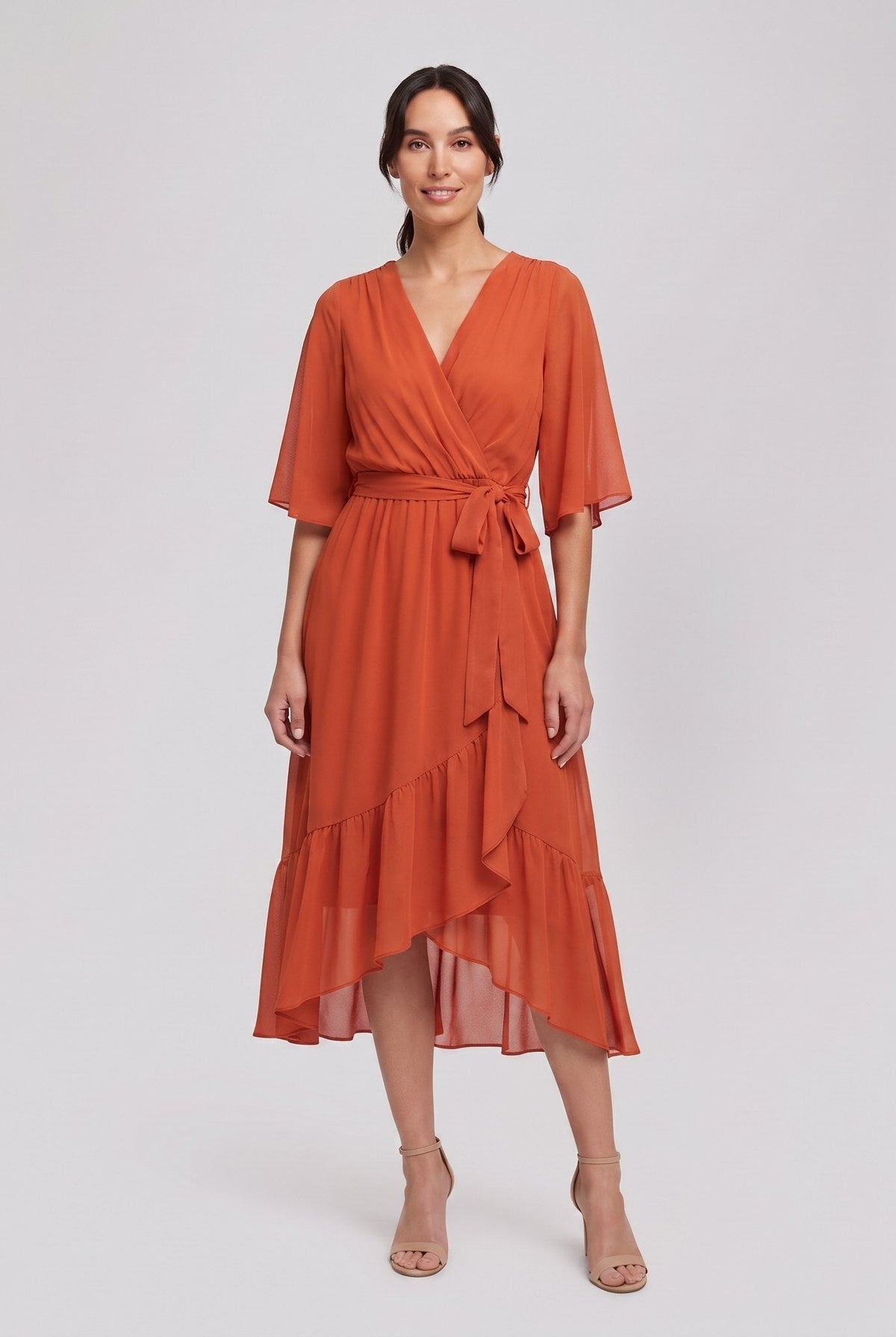 Burnt orange Gina wrap midi dress with V-neck and flutter sleeves on model