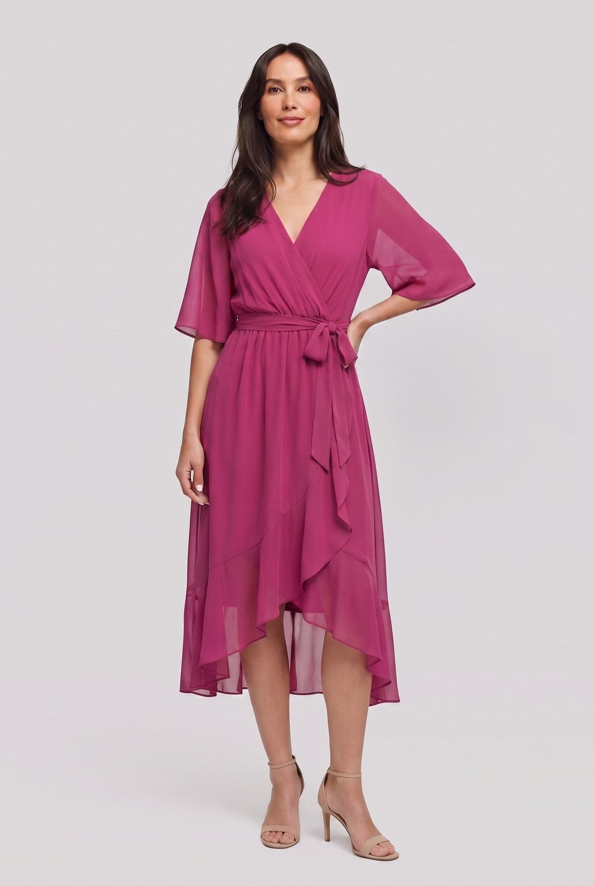 Fuchsia pink Gina wrap midi dress with V-neck and flutter sleeves on model