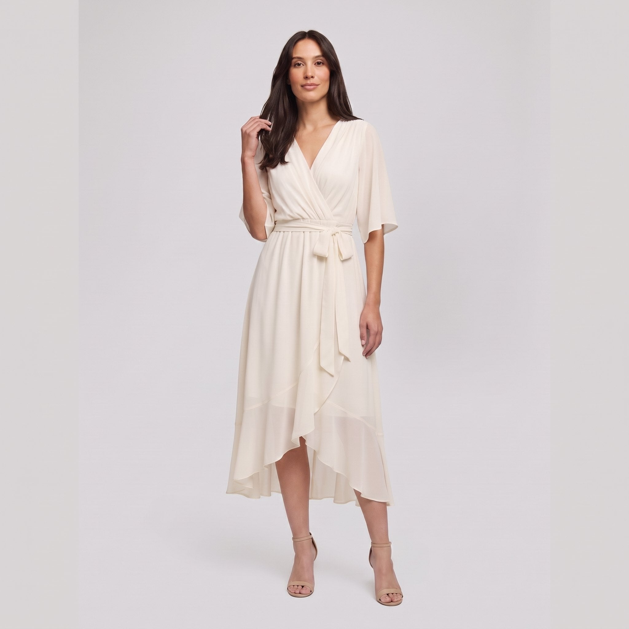 Ivory white Gina wrap midi dress with V-neck and flutter sleeves on model