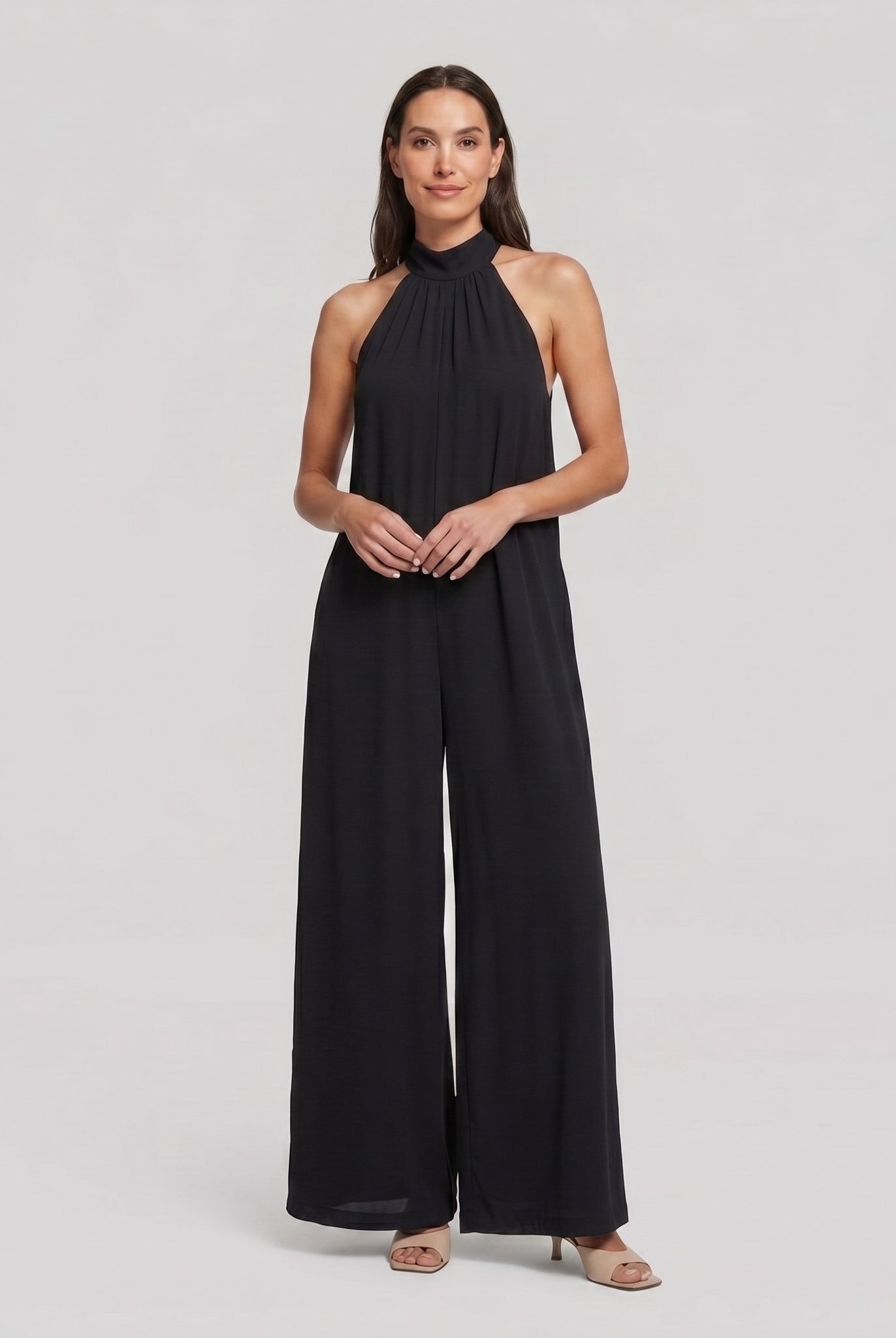 Black halter neck wide leg jumpsuit on model, front pose - Pamela Boutique