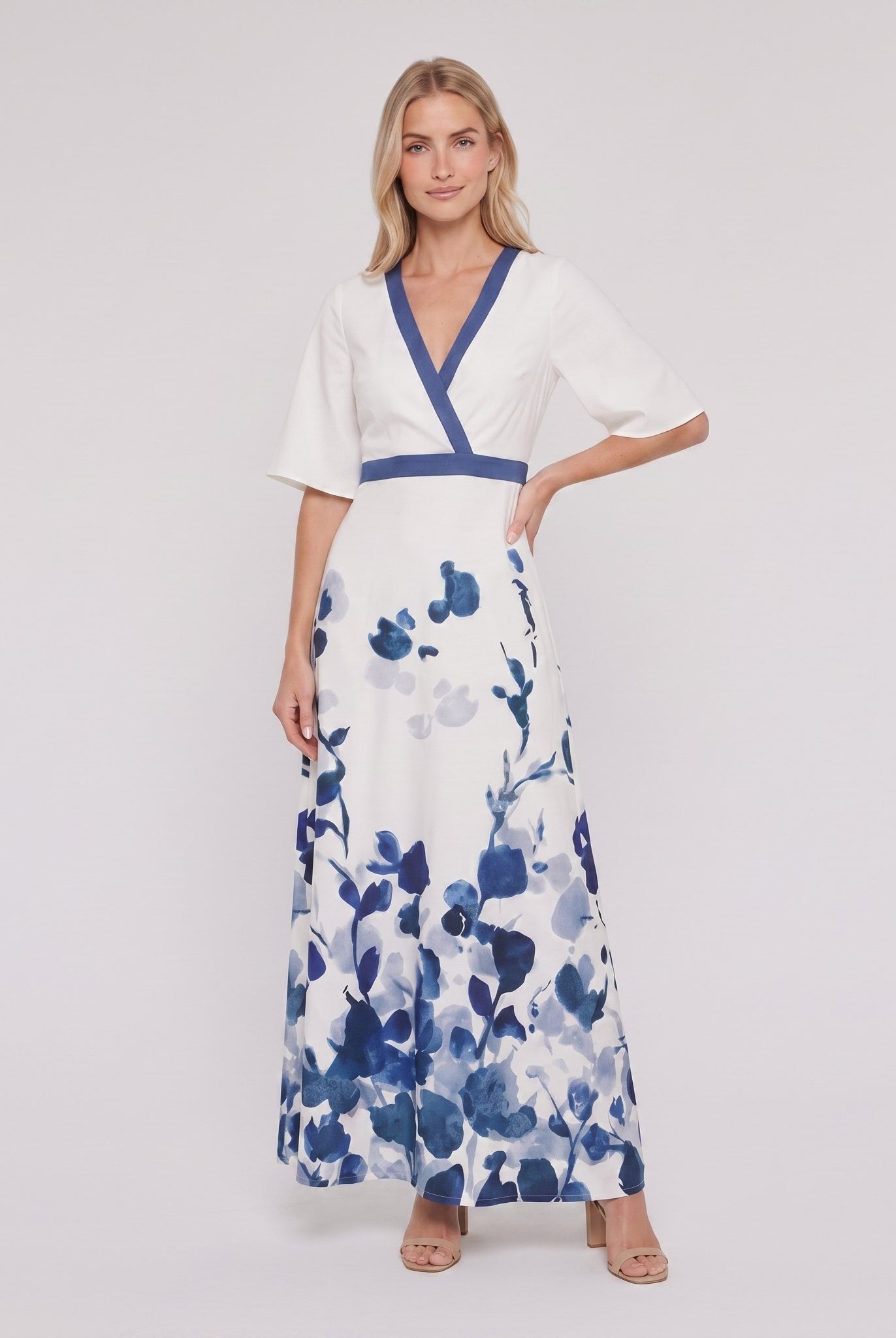 White and blue floral maxi dress with V-neck on model