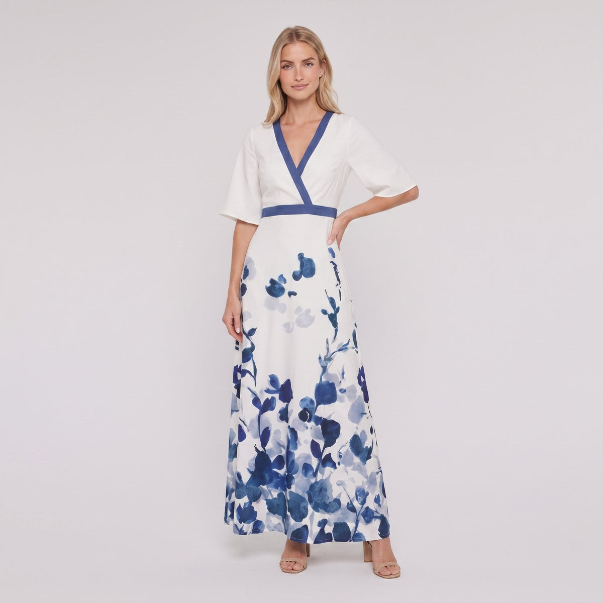 White and blue floral maxi dress with V-neck on model