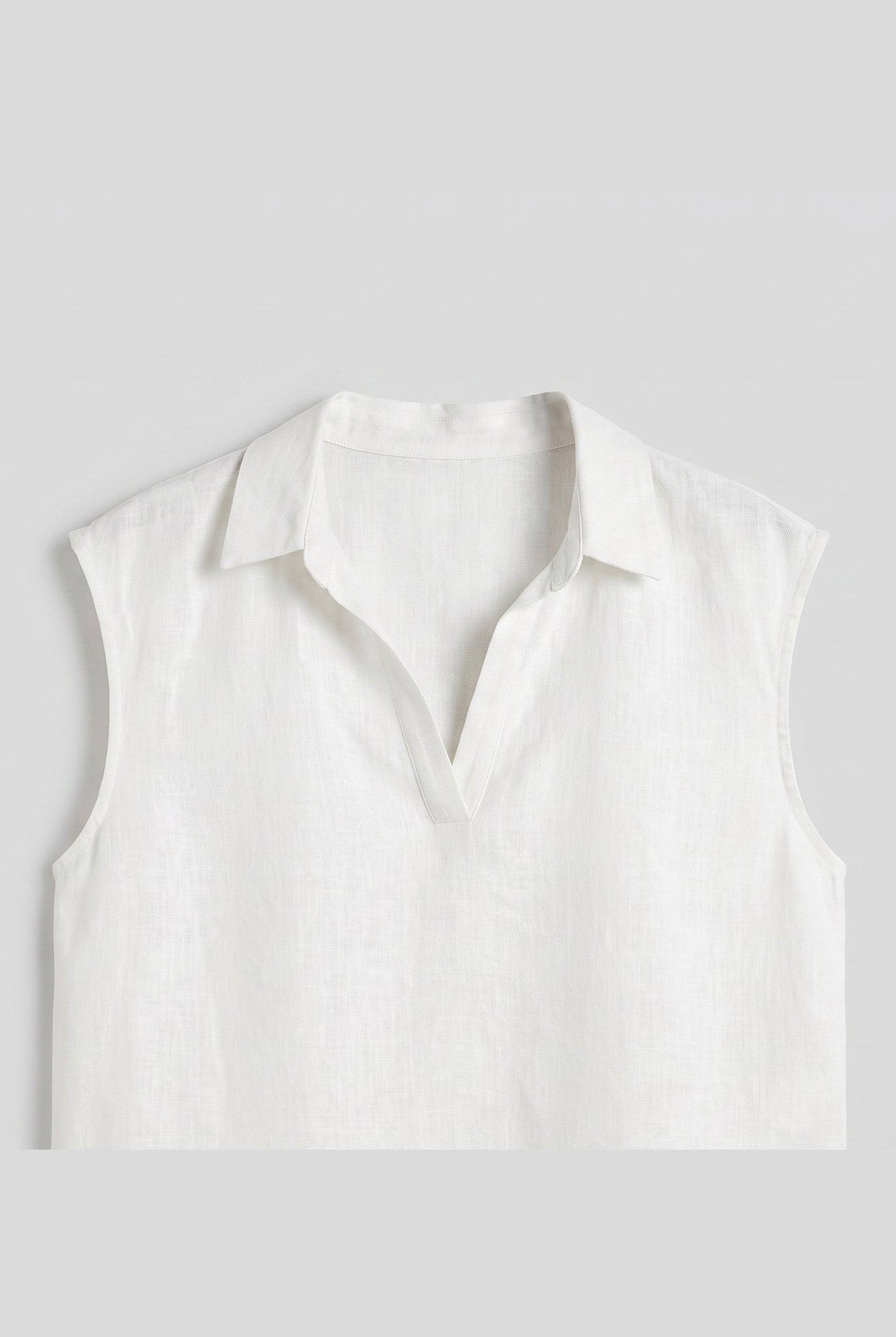 White linen sleeveless crop top flat-lay product photo