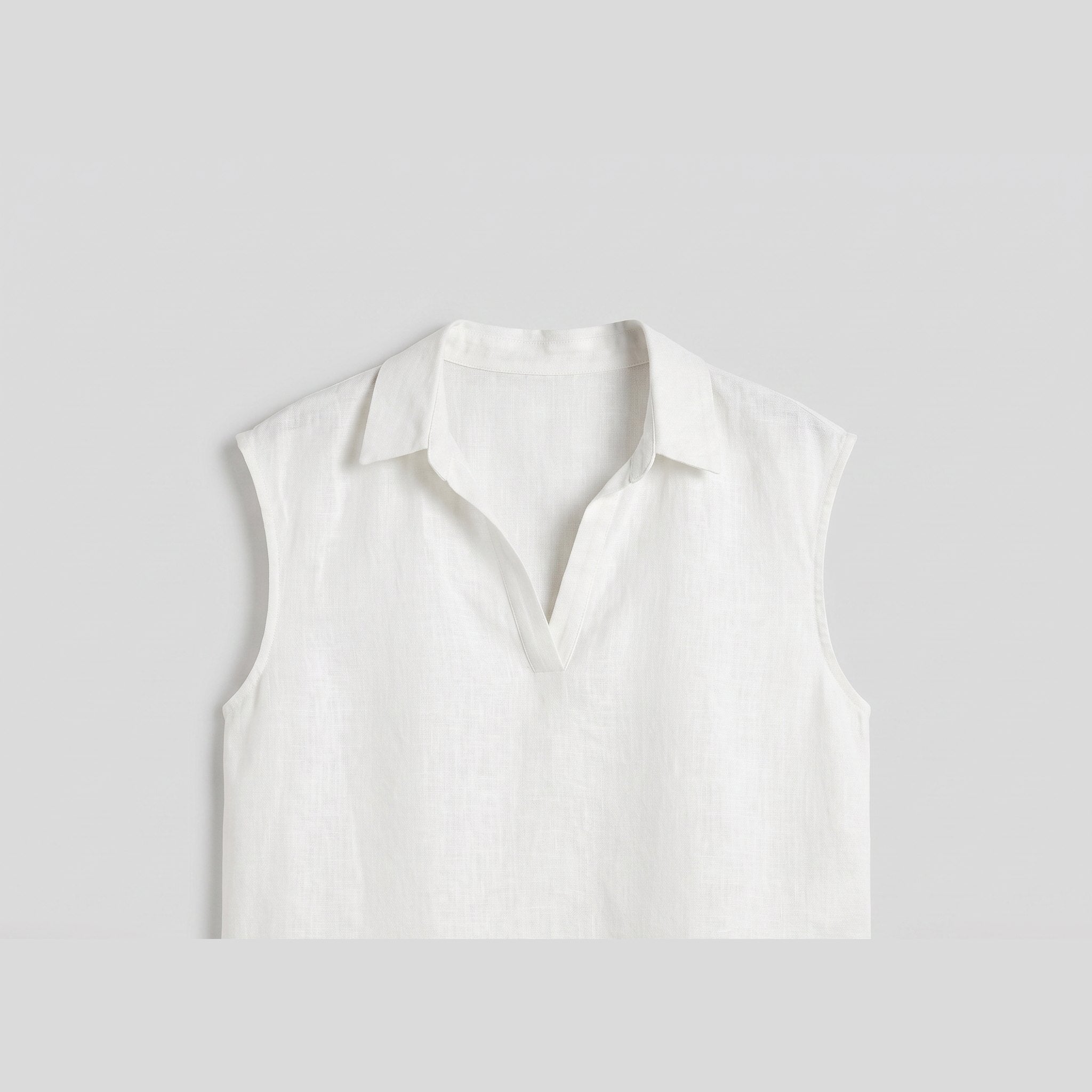 White linen sleeveless crop top flat-lay product photo