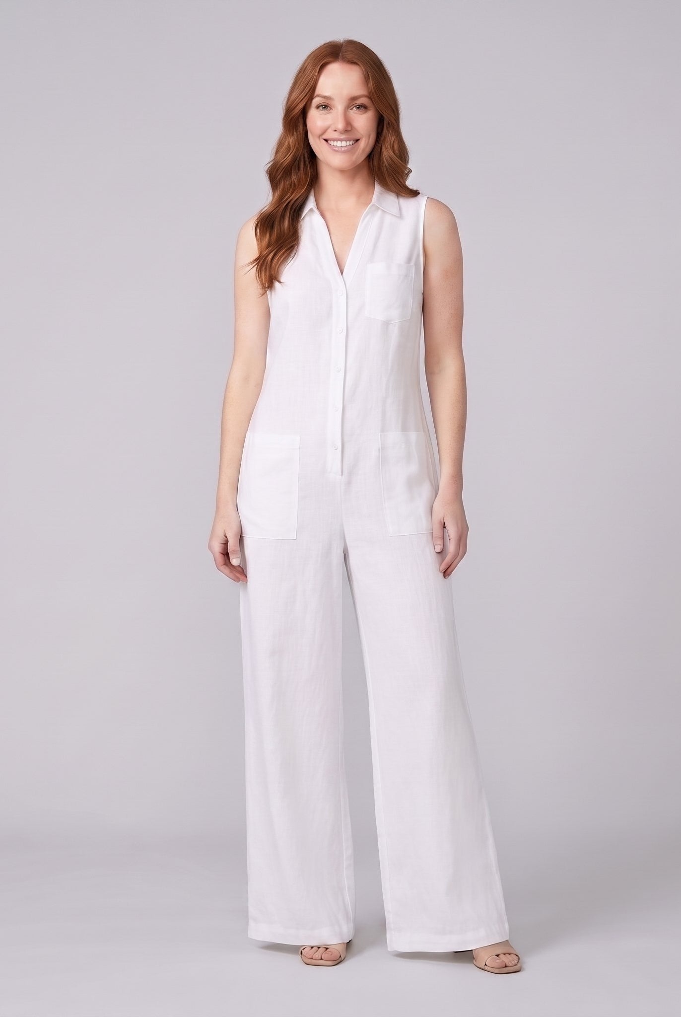 White sleeveless wide-leg linen jumpsuit, front view on model