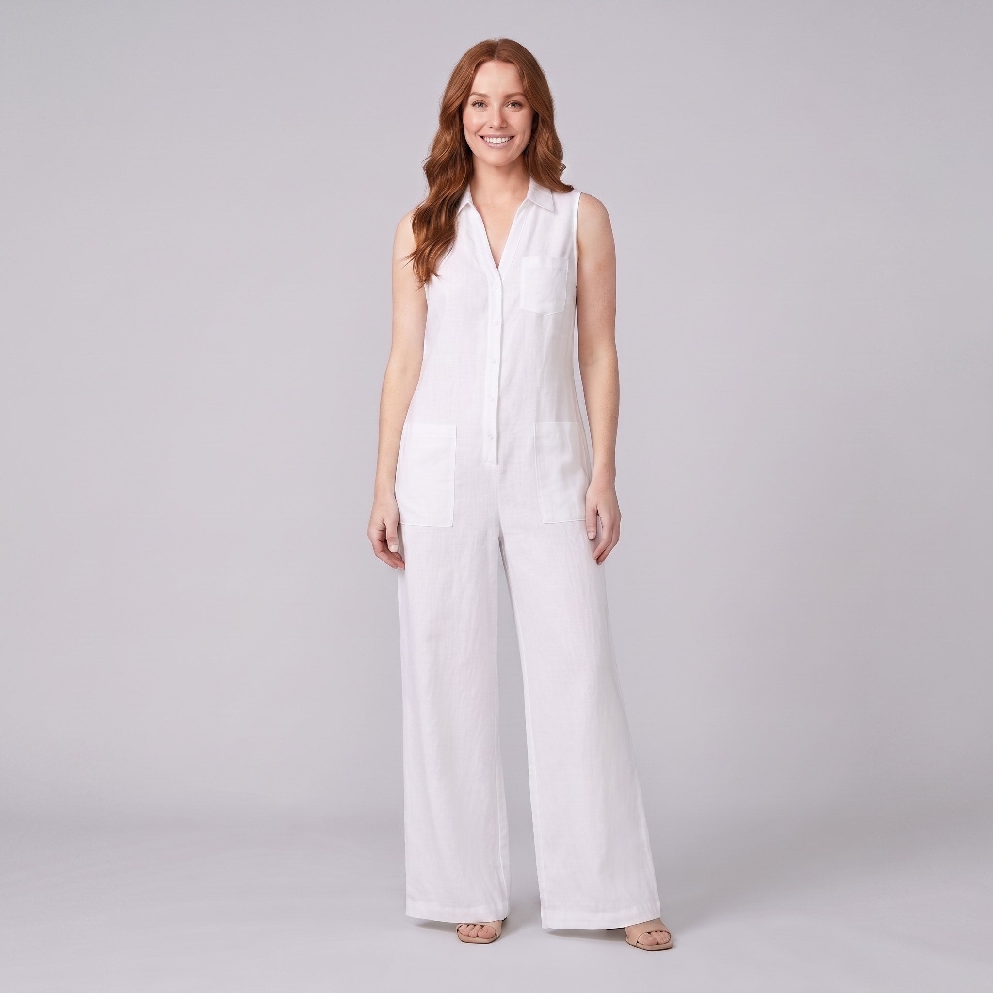 White sleeveless wide-leg linen jumpsuit, front view on model
