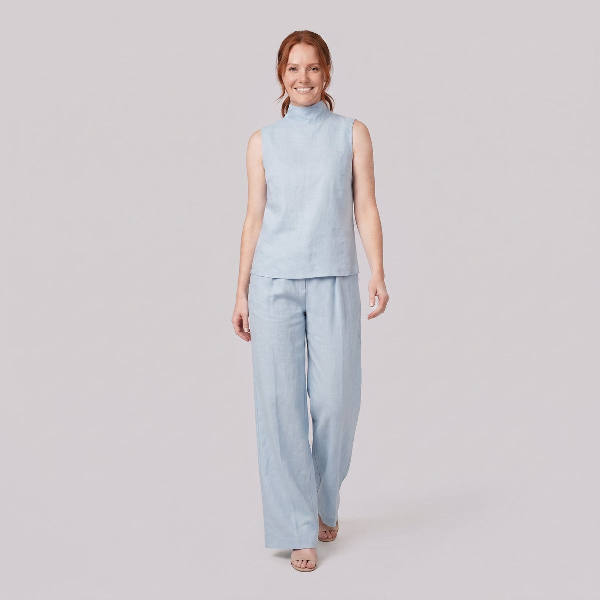 Mira two-piece set in light blue, sleeveless high-neck blouse with wide-leg trousers