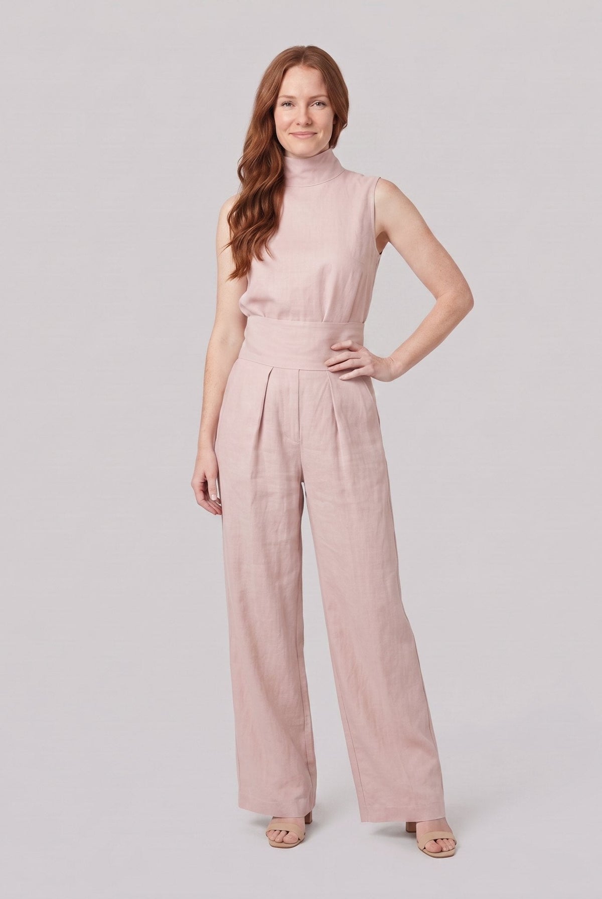 Mira two-piece set in light pink, sleeveless high-neck blouse with wide-leg trousers