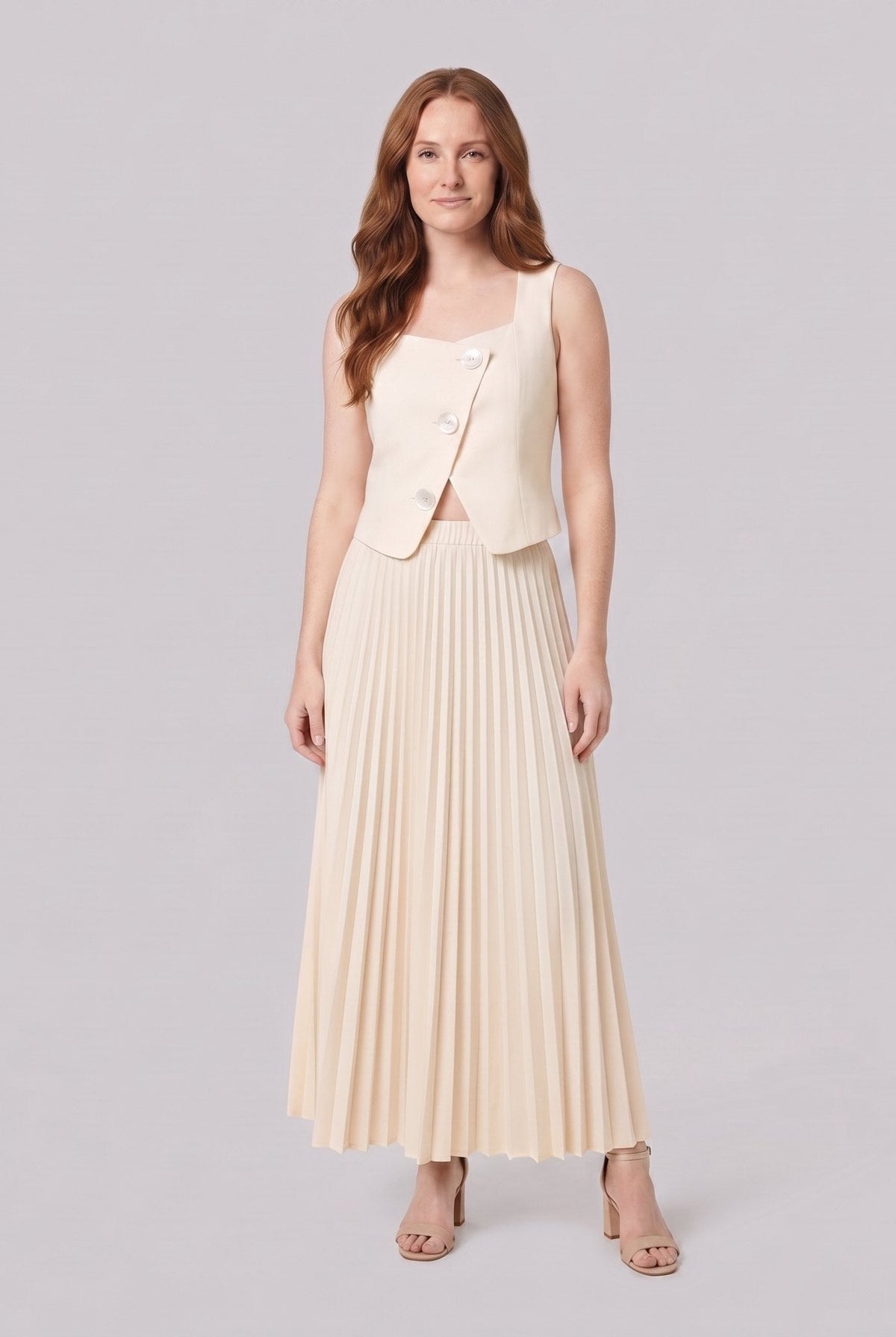 Sera Chic cream sleeveless waistcoat top and pleated maxi skirt, front view