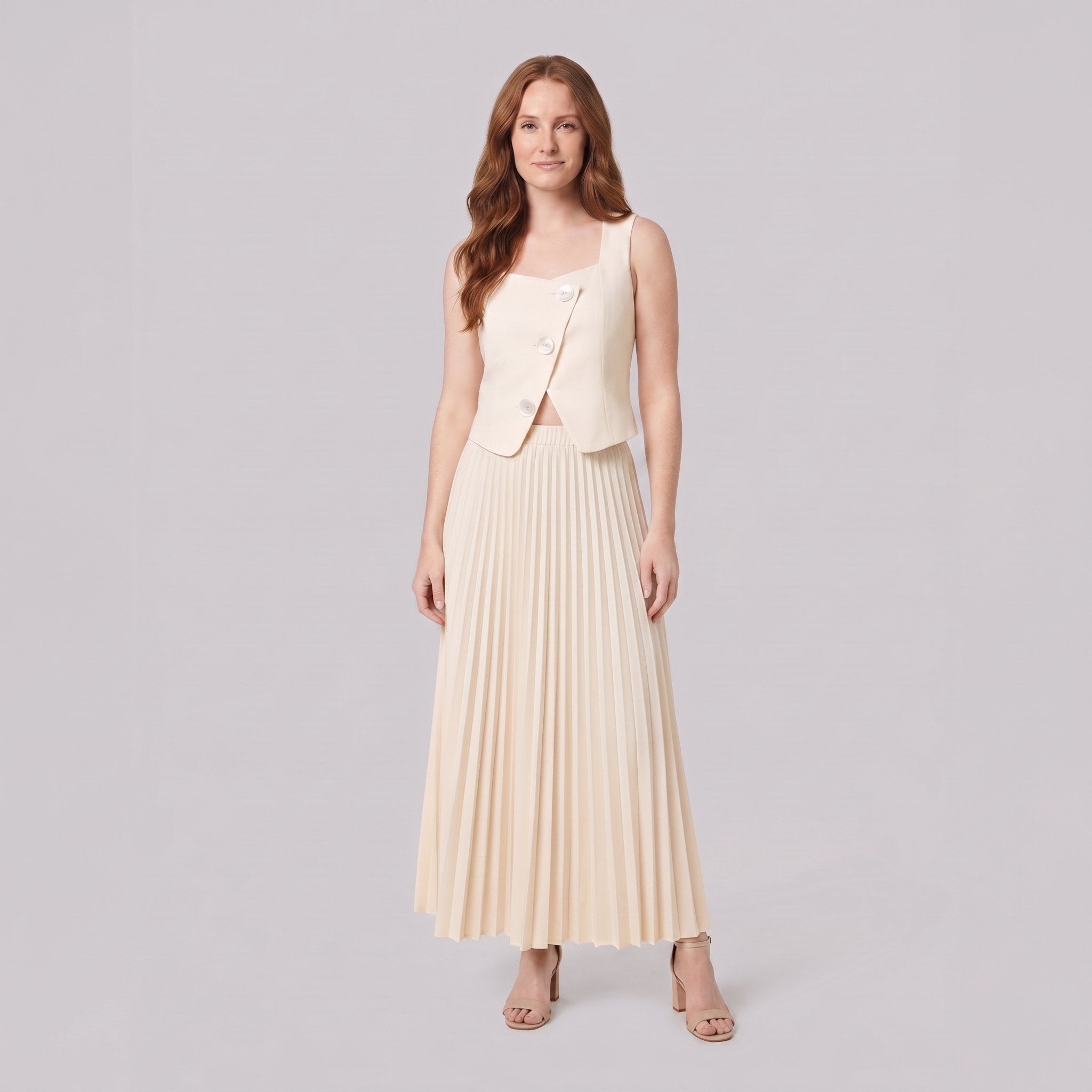 Sera Chic cream sleeveless waistcoat top and pleated maxi skirt, front view