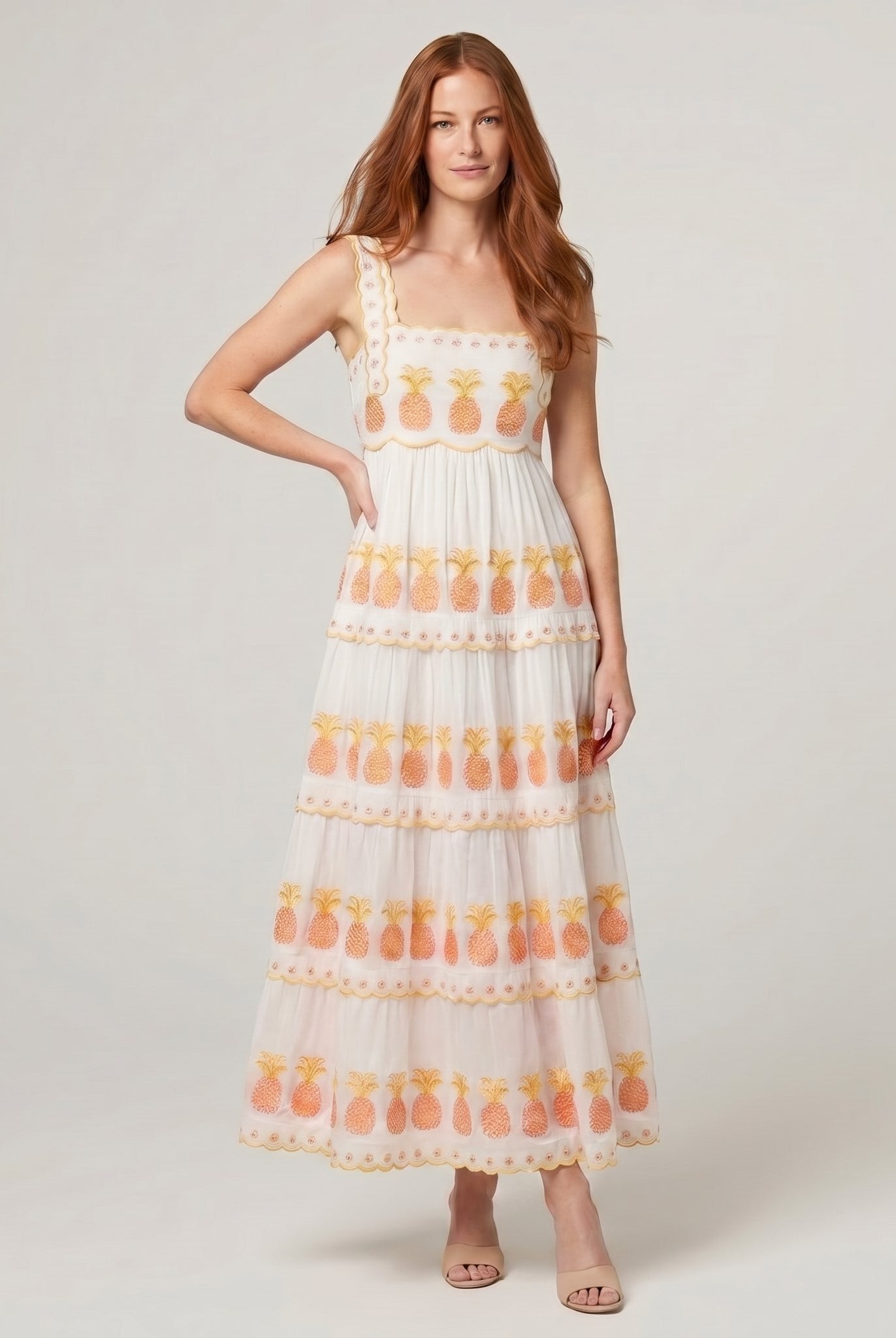 Women's white square-neck tiered maxi dress with pineapple embroidery, full-length model photo