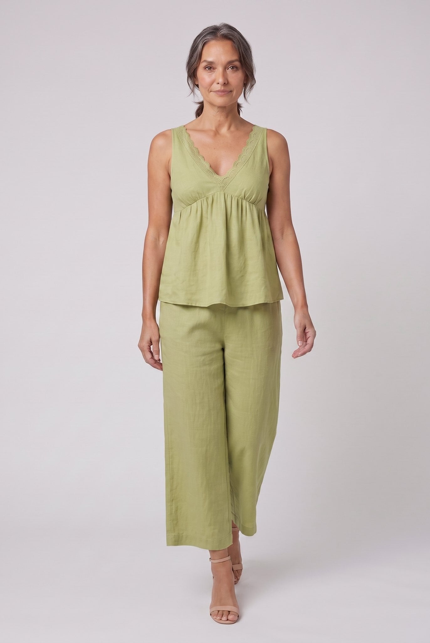 Vera sage green lace-trimmed loungewear set walking