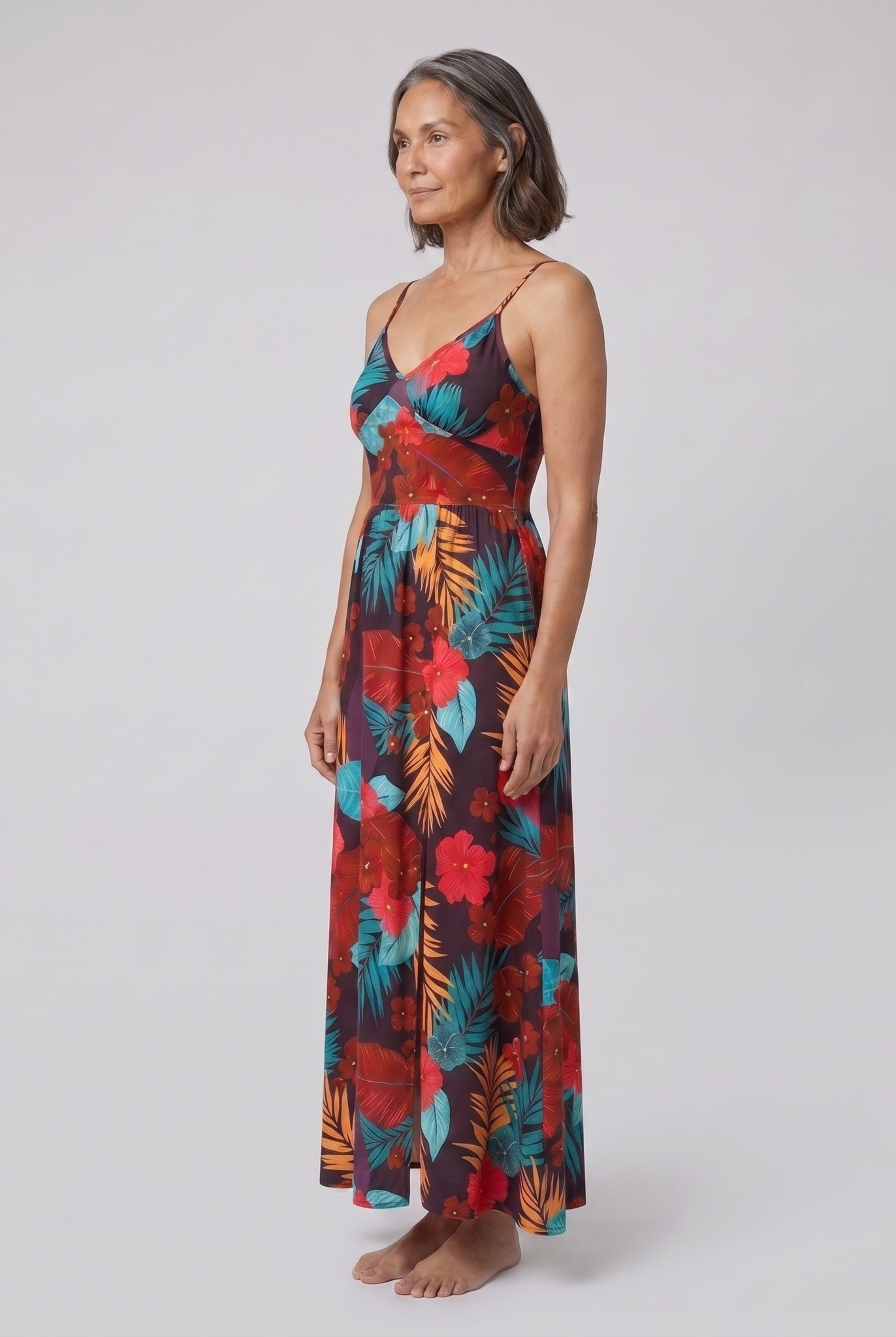 Vera maxi dress in floral print — three-quarter side view showing the silhouette