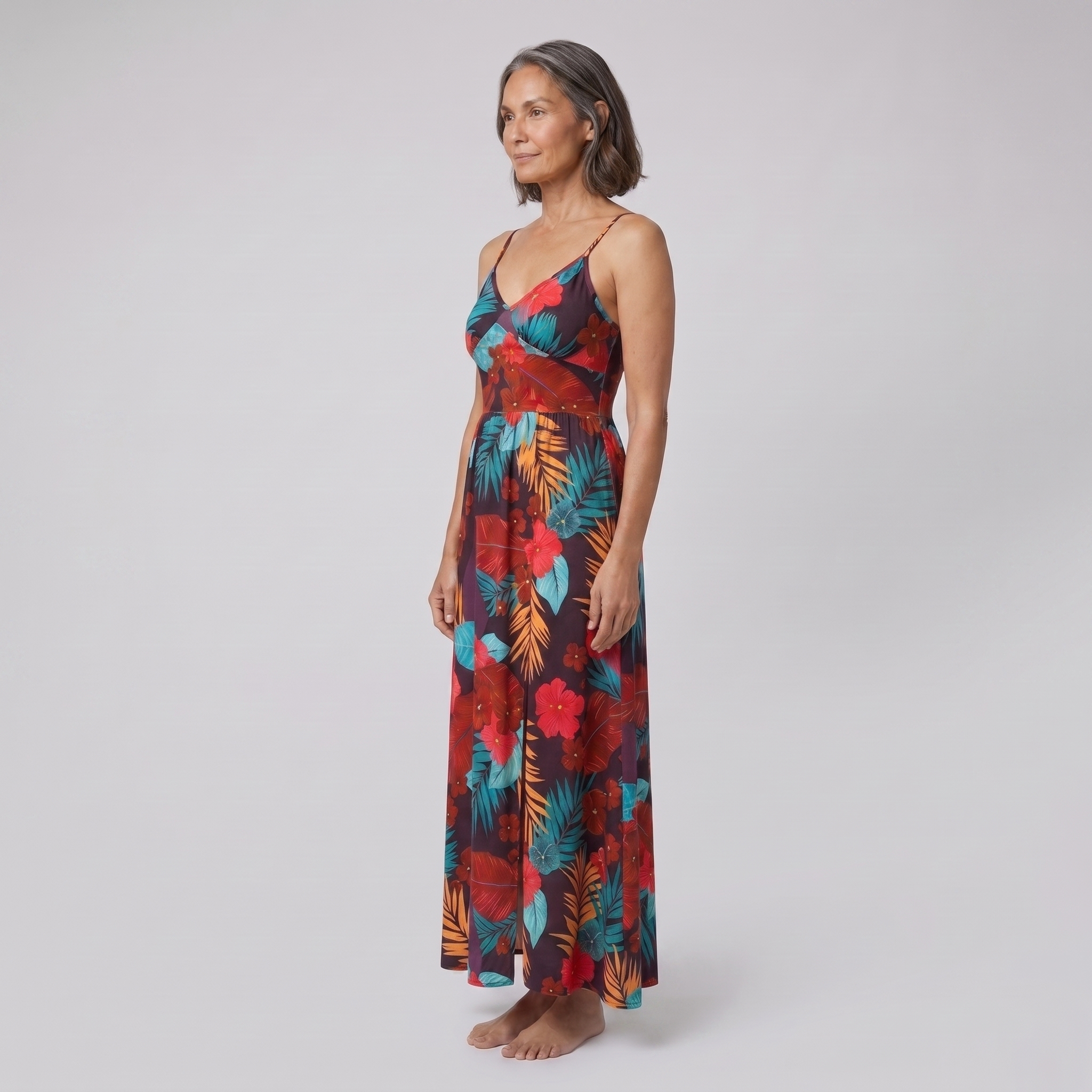 Vera maxi dress in floral print — three-quarter side view showing the silhouette