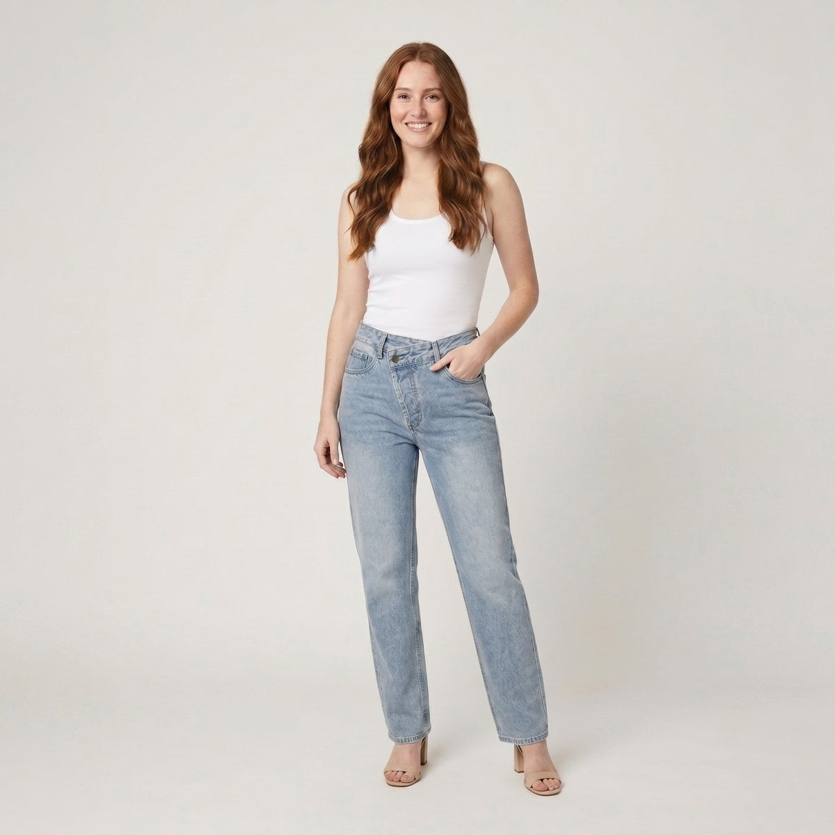 Straight leg jeans in a cotton blend with an asymmetric waist, view 1