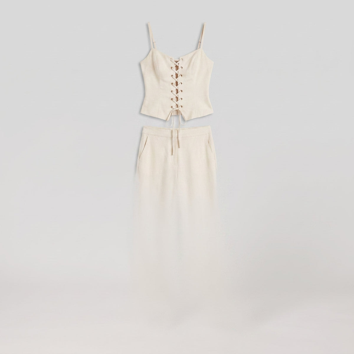 White lace-up top and wide-leg trouser co-ord, product flat lay