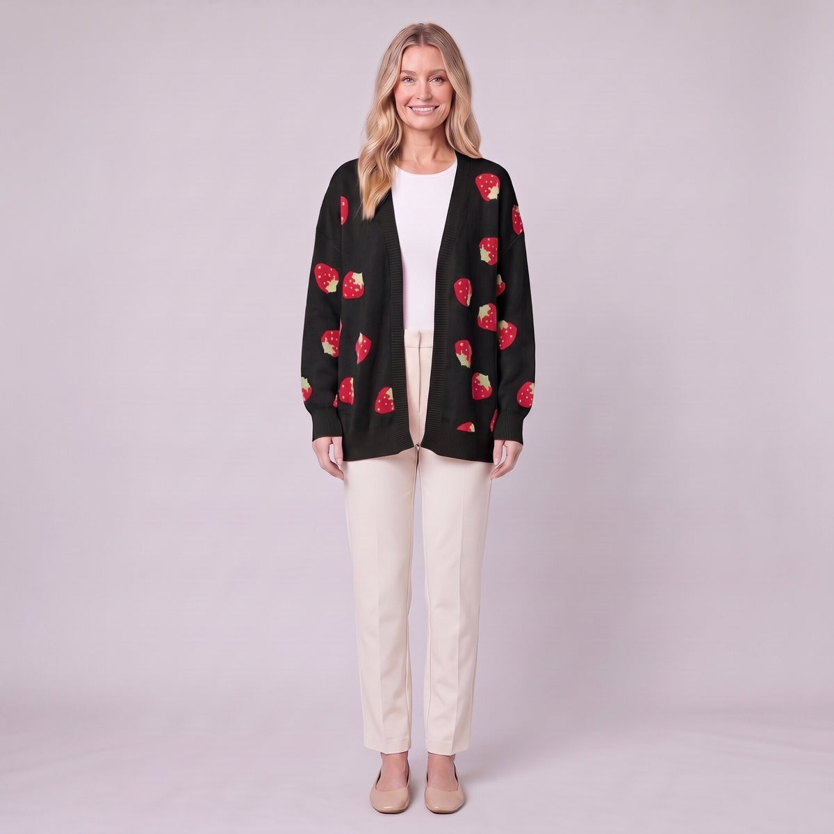 Cerise strawberry open front cardigan in black, front view on model