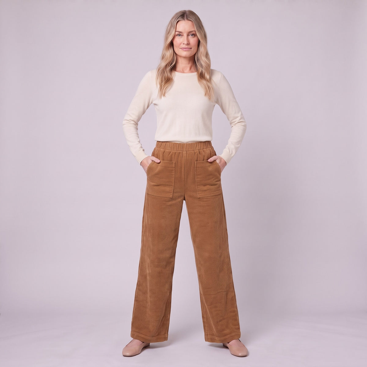 Cielle corduroy trousers in tobacco brown, full-length view with hands in the patch pockets
