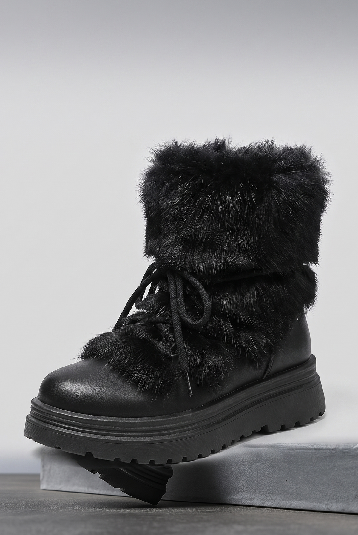 Insulated lace-up winter boots with a faux fur cuff and non-slip sole, view 1