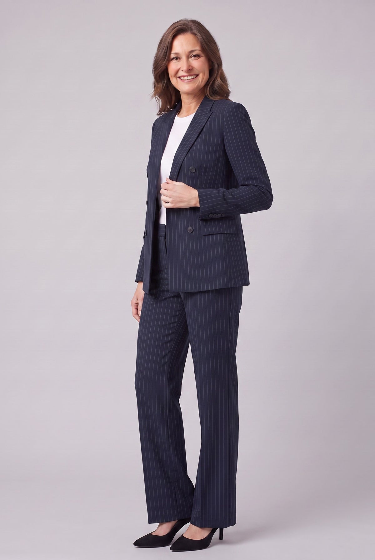 Iris navy pinstripe suit, three-quarter view showing the lapel