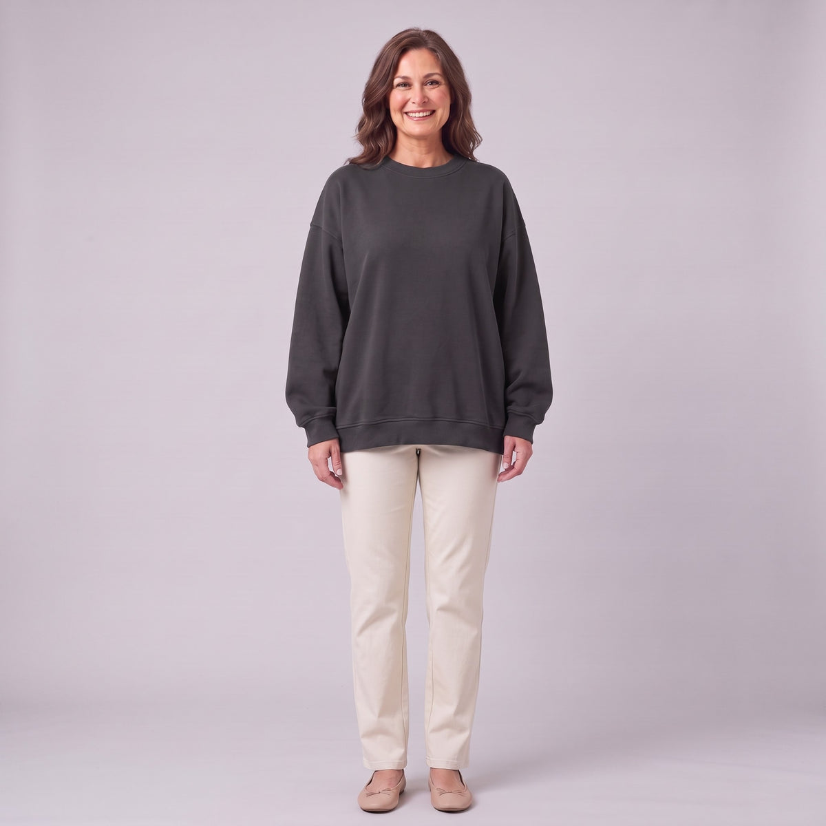 Kaia oversized sweatshirt in dark charcoal grey, front view on model