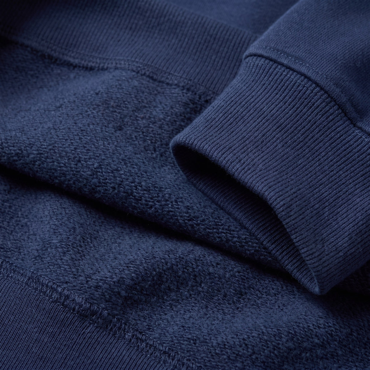Kaia oversized sweatshirt in navy, close-up of the brushed organic cotton fabric