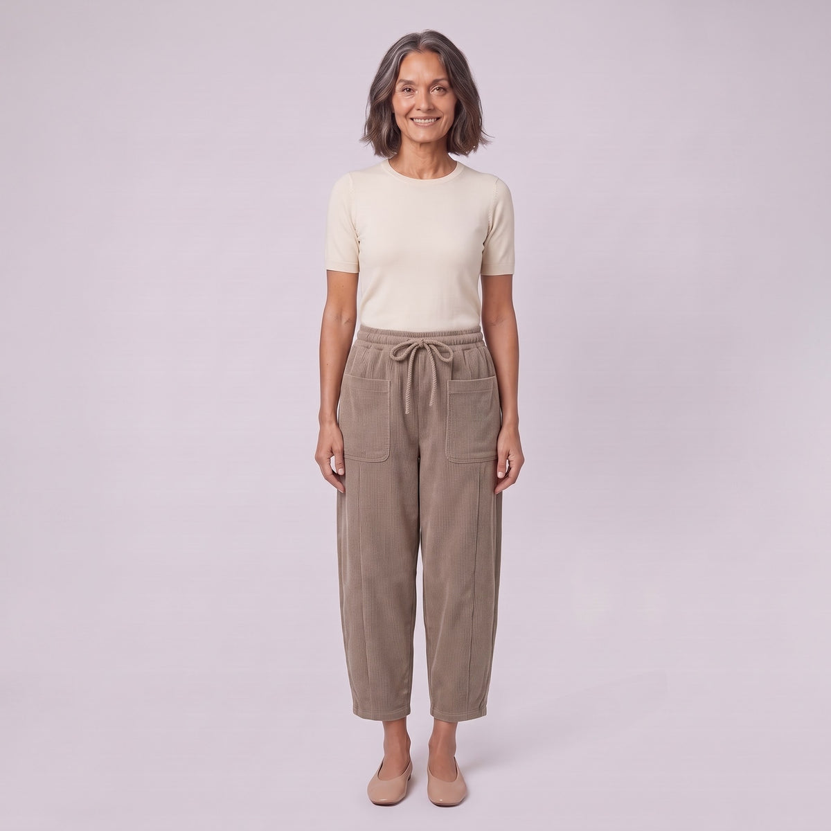 Kerensa barrel leg corduroy trousers in khaki taupe, drawstring waist, front view on model