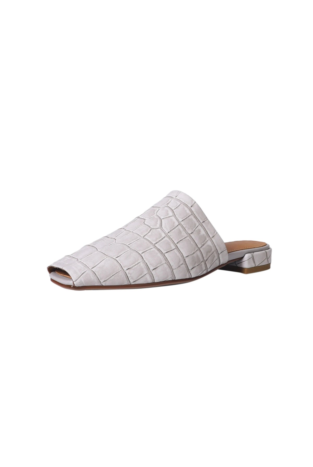 Close view of the croc-embossed texture on the mule, view 5
