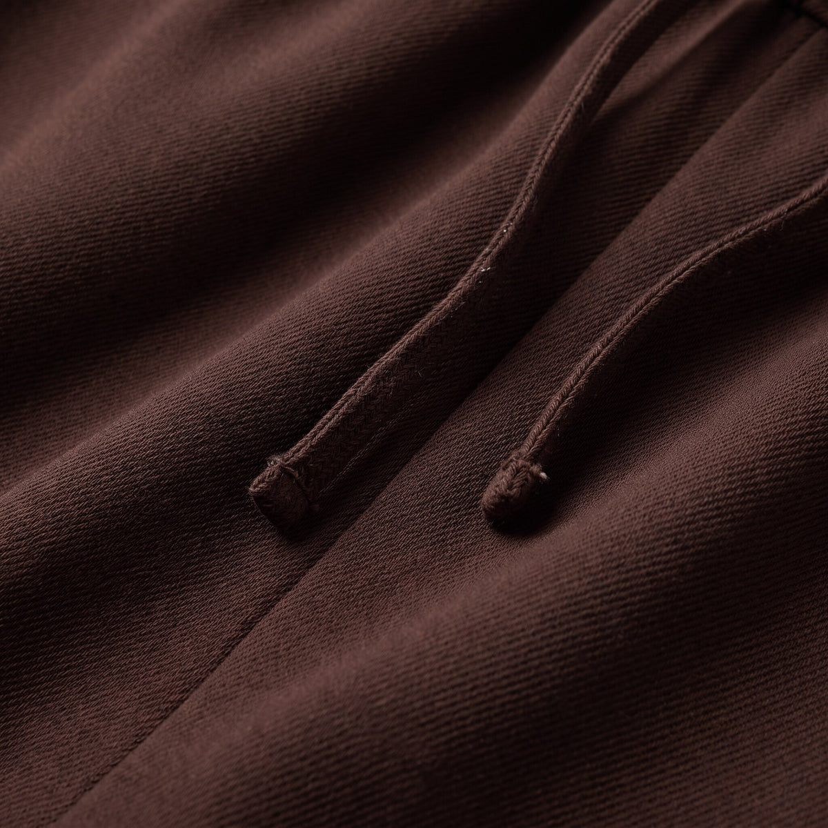 Mairead wide leg trousers fabric detail, soft twill weave and drawstring close-up in chocolate brown