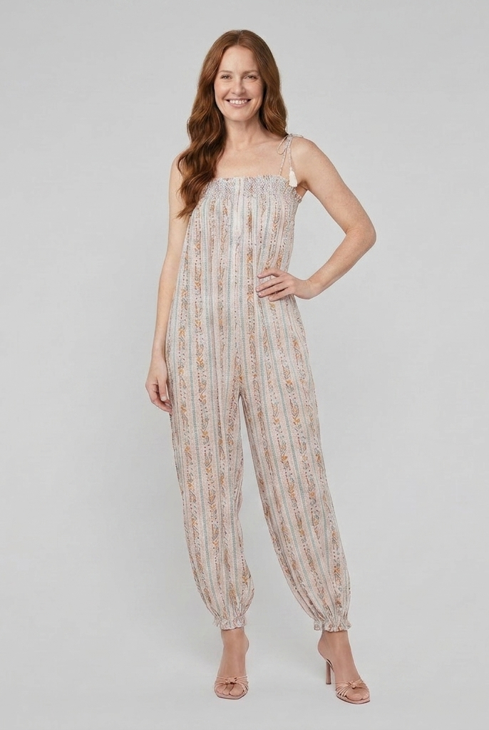 White jumpsuit with wide-leg trousers and adjustable straps, front view