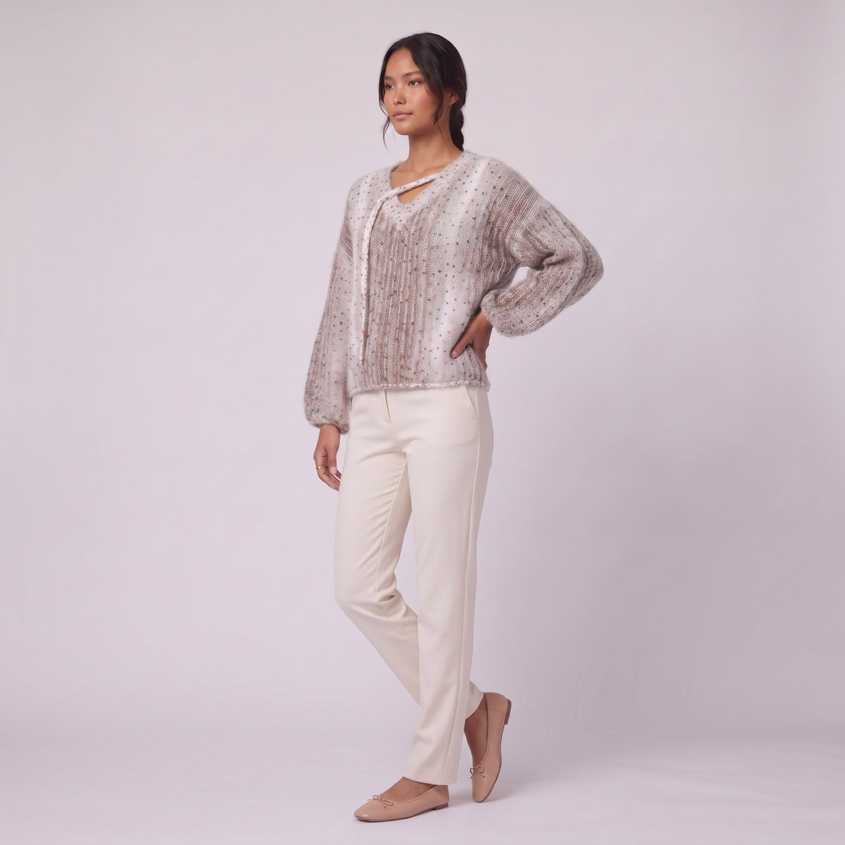 Nerissa speckled knit sweater in oatmeal, three-quarter view showing the balloon sleeves