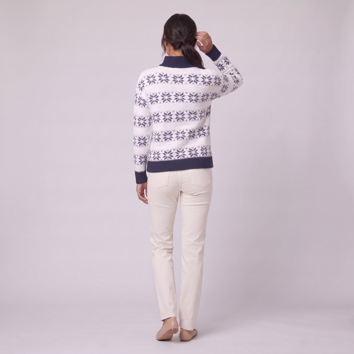 Nova snowflake knit sweater in navy blue, back view on model