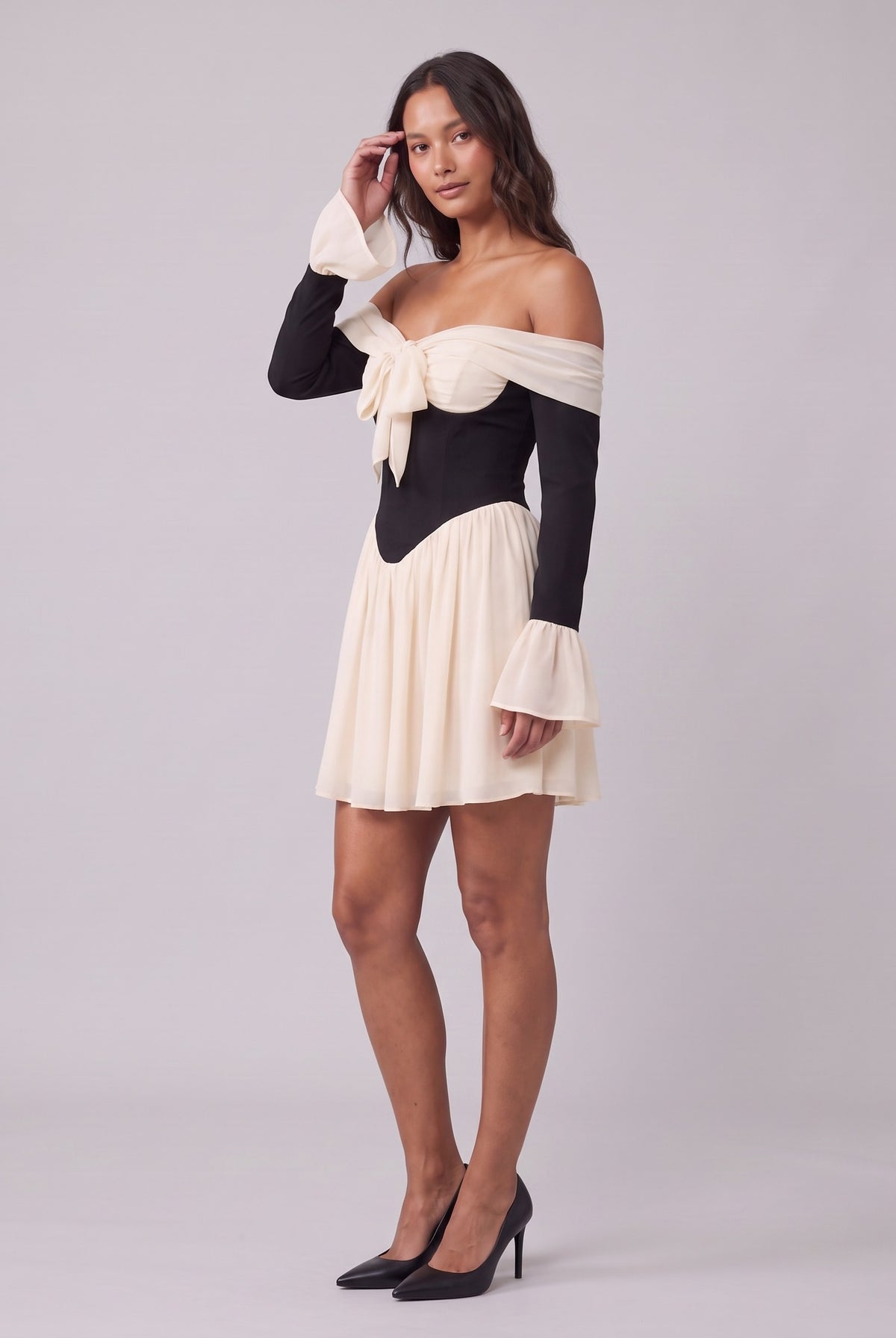Odette corset mini dress, three-quarter view showing the gathered skirt