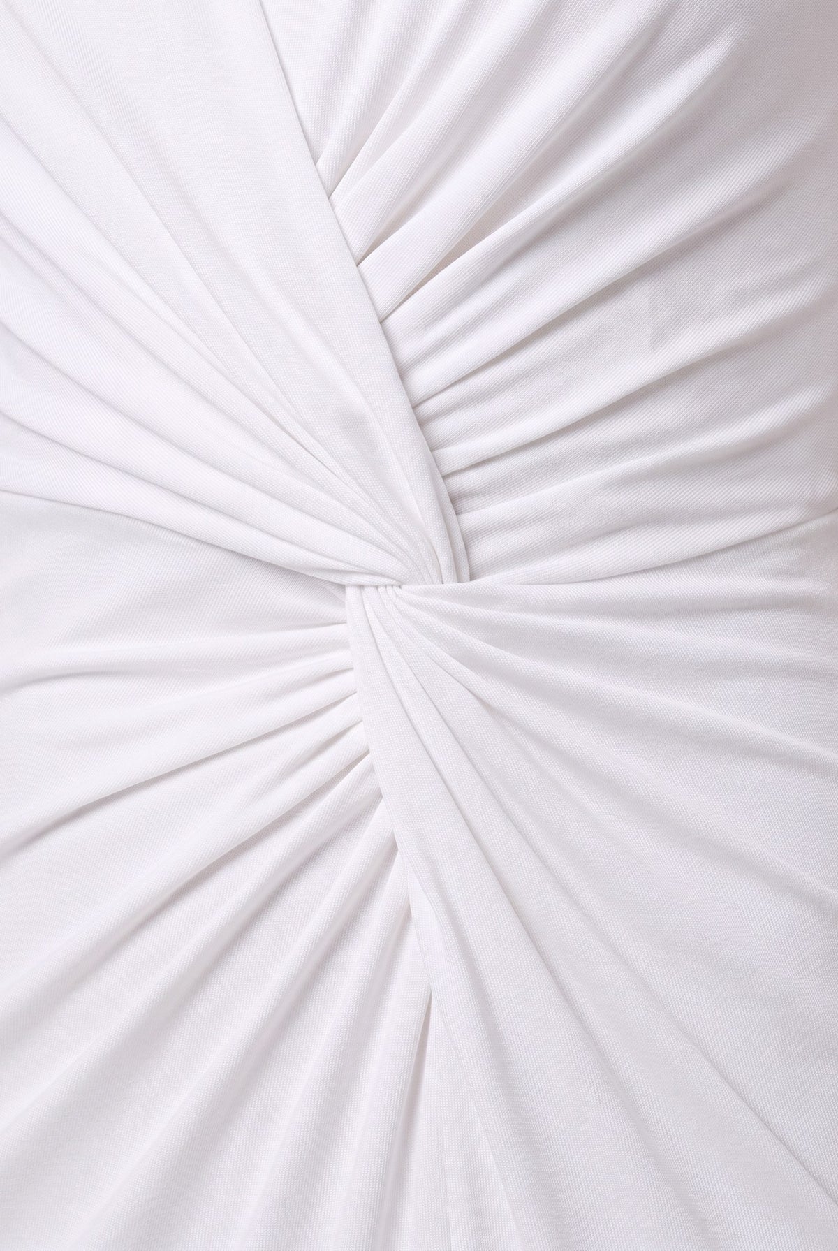 Close-up of the ruched twist knot and jersey fabric of the Perrine white maxi dress