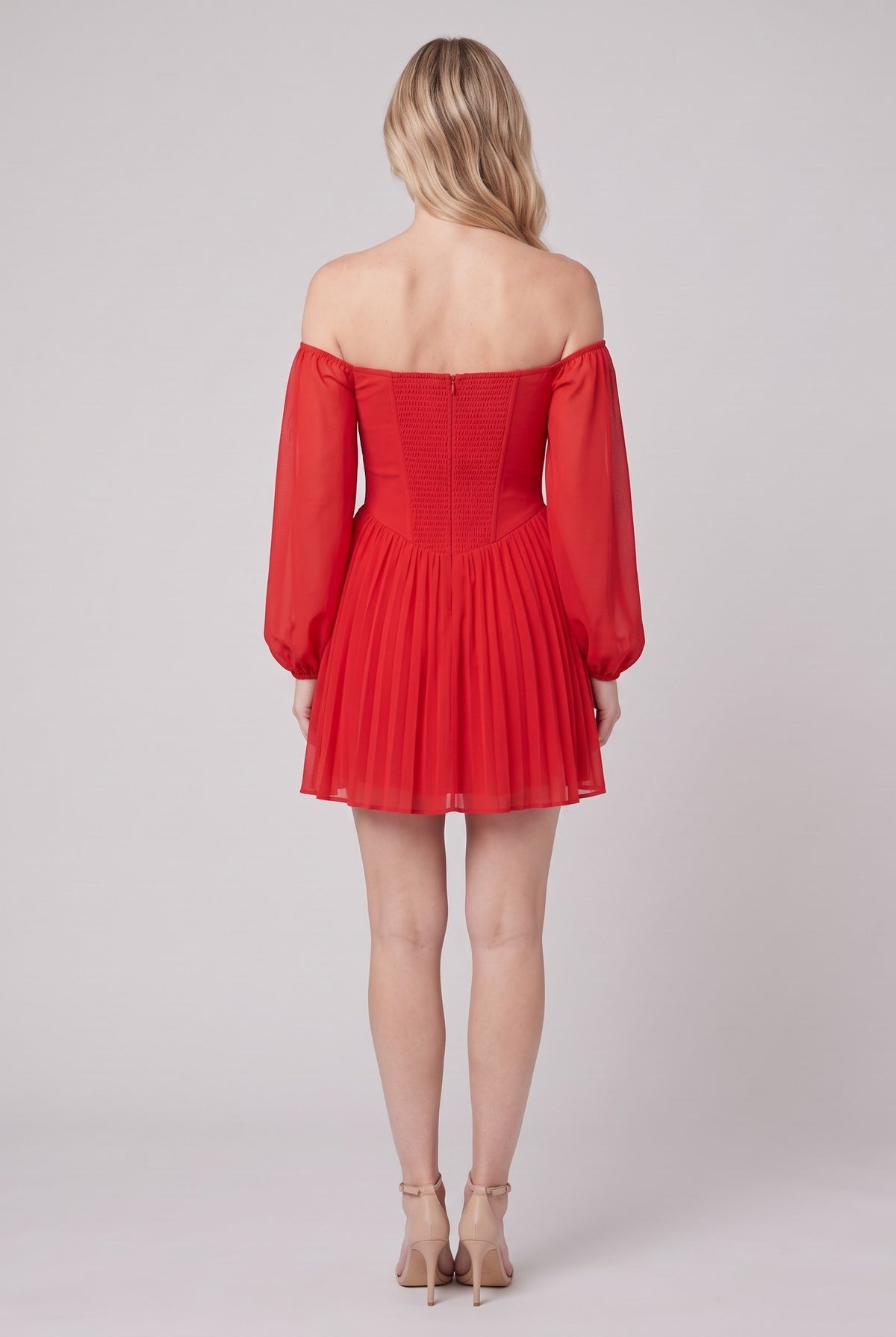 Scarlet Muse red mini dress seen from behind, showing the shirred back