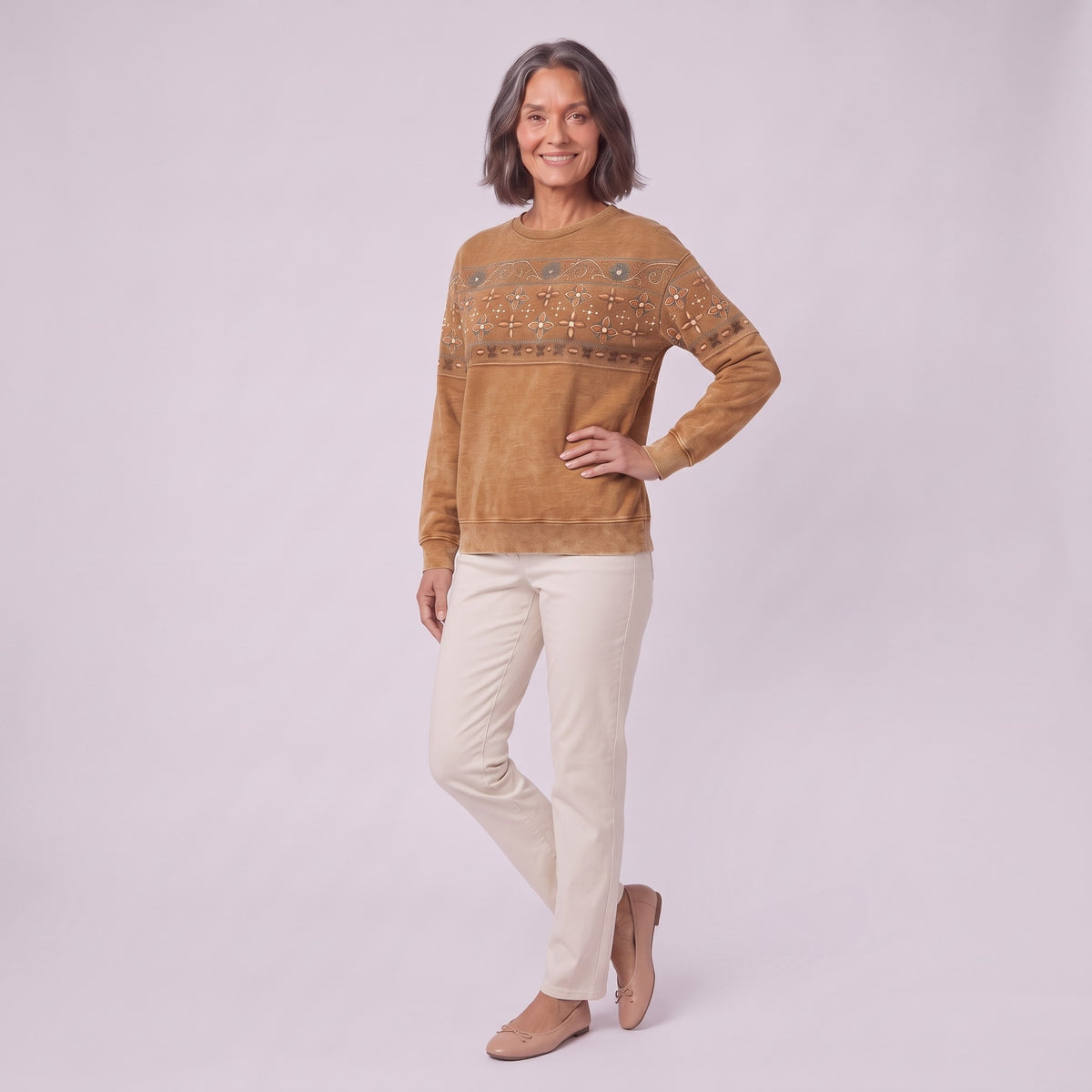 Sedona printed sweatshirt in caramel, three-quarter view showing the folk border