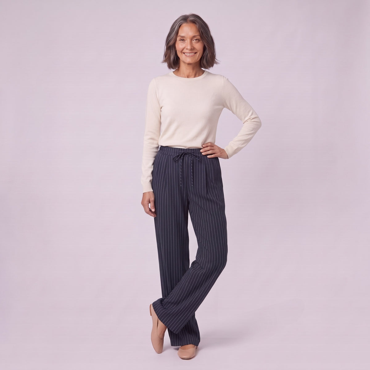 Sidony pinstripe wide leg trousers in navy blue, three-quarter view showing the drawstring waist