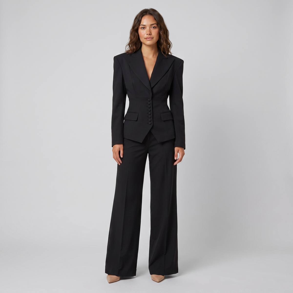 Black tailored suit with a peak lapel blazer and wide-leg trousers, view 1