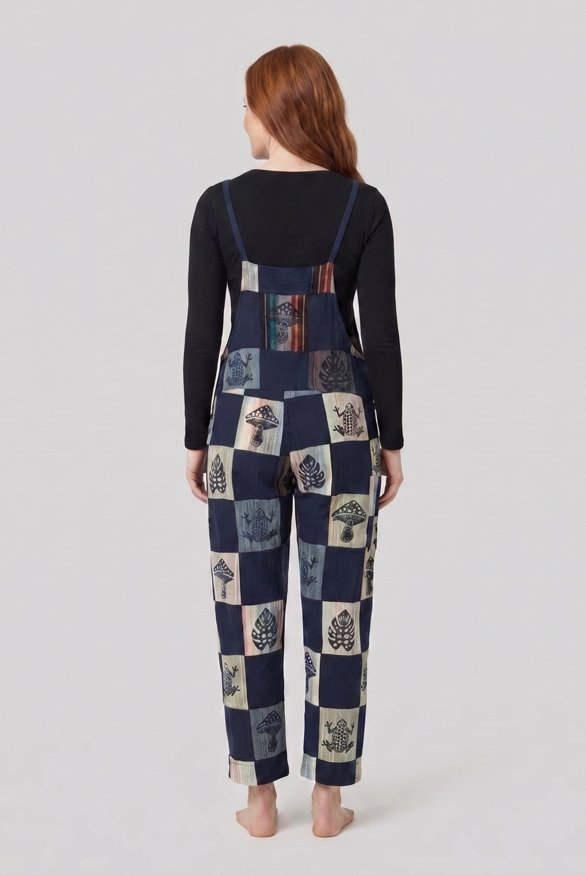 Denim dungarees showing the strap fastenings, back view
