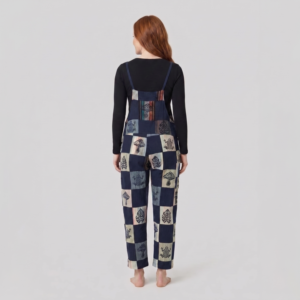 Denim dungarees showing the strap fastenings, back view
