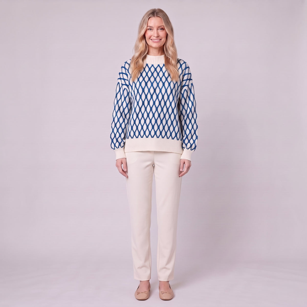 Zinnia lattice knit sweater in cream and cobalt blue, front view on model