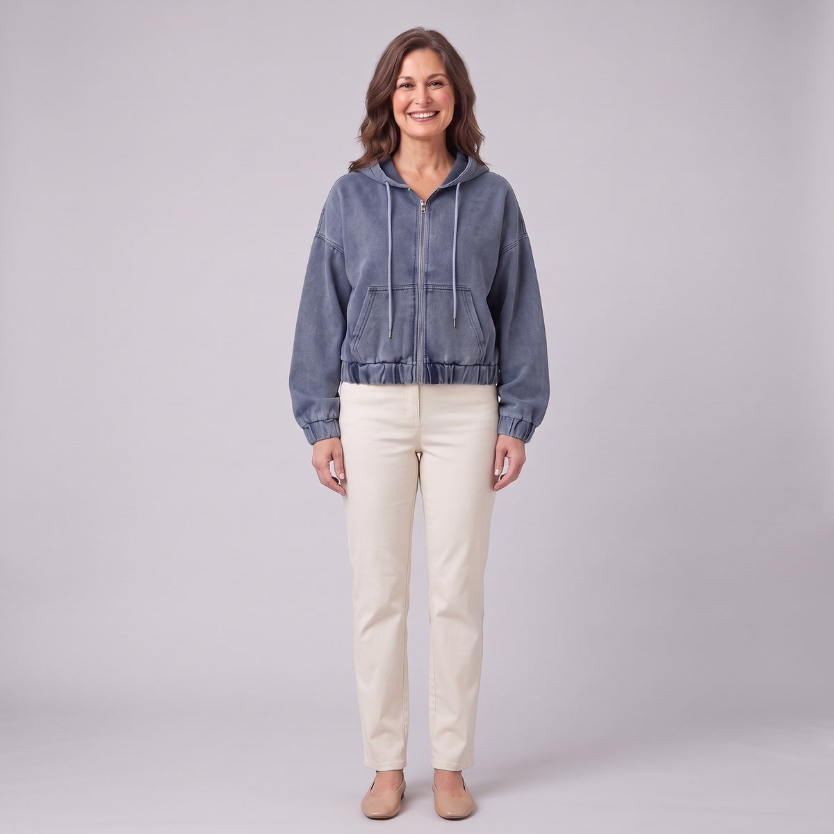 Zosia cropped denim hoodie in slate blue, zip front, front view on model