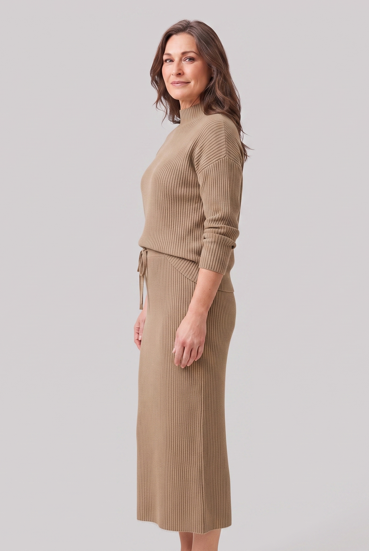 Soraya knit sweater and skirt set in taupe, side view on model