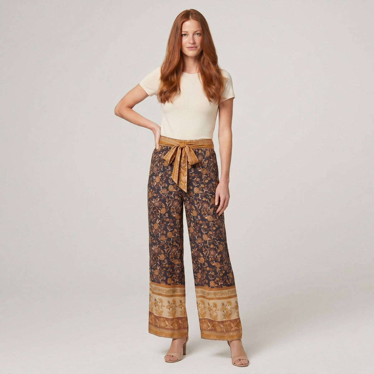 Pamela Boutique brown floral wide-leg trousers with tie belt, model front view