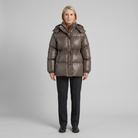 Cleo glossy quilted hooded puffer jacket in brown on model