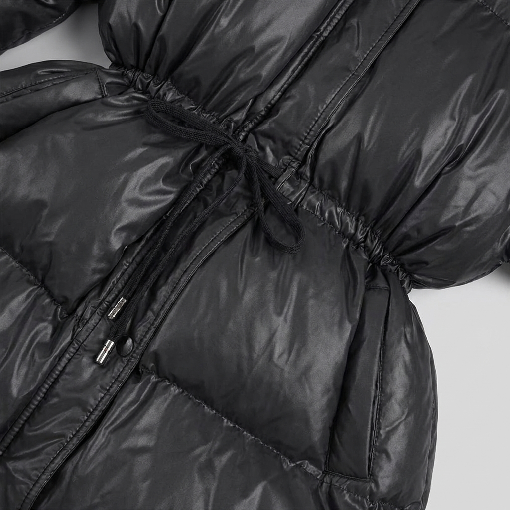 Cleo puffer jacket drawstring waist and glossy quilting close-up