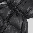 Cleo puffer jacket drawstring waist and glossy quilting close-up