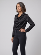 Dalia draped cowl-neck blouse in black on model